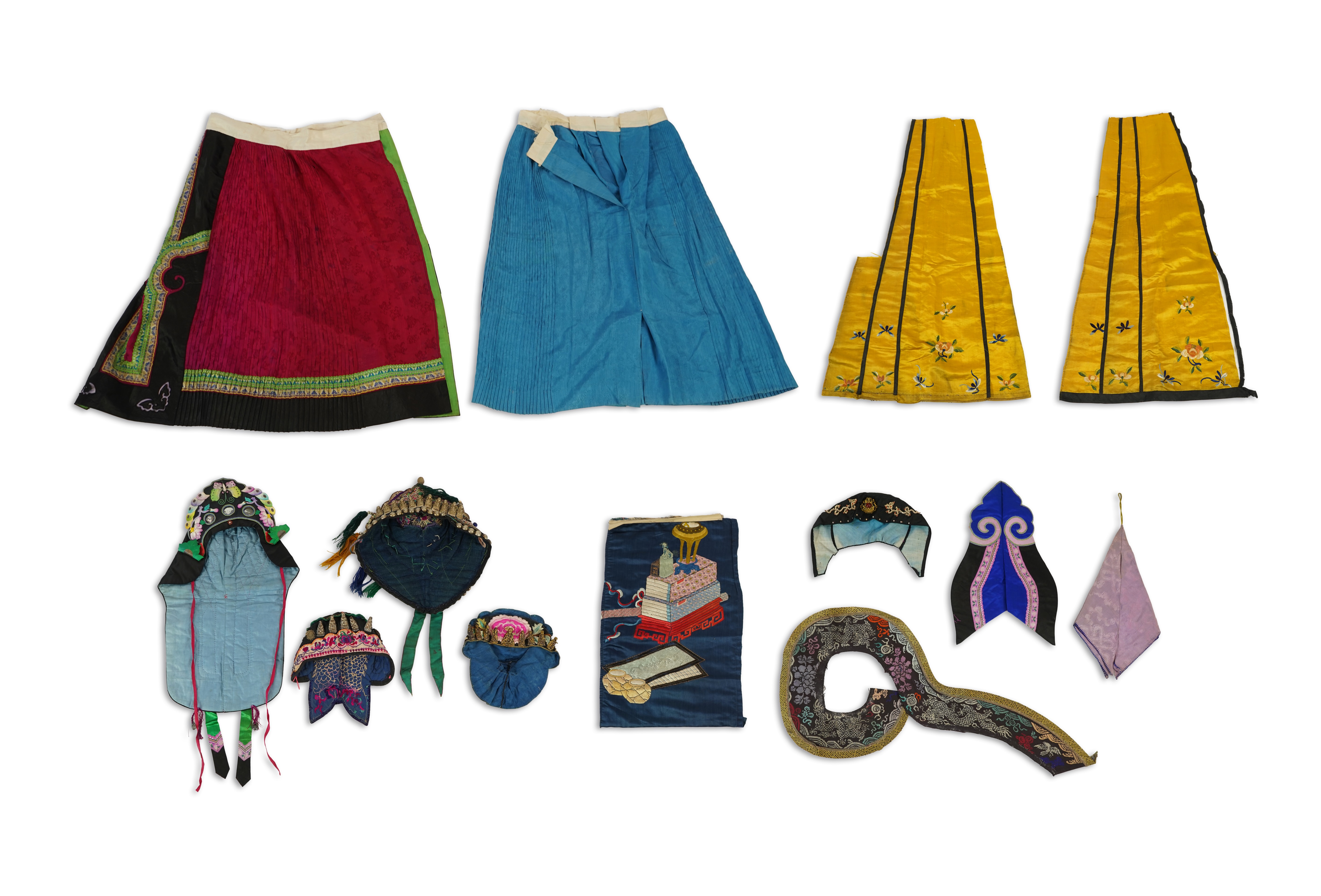 Two Chinese embroidered silk wedding skirts, late Qing, five hats, trousers, two skirt panels and two others, collar and a panel